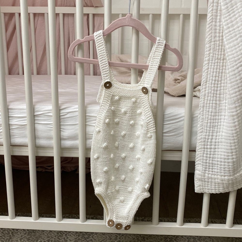 Crocheted baby onesie